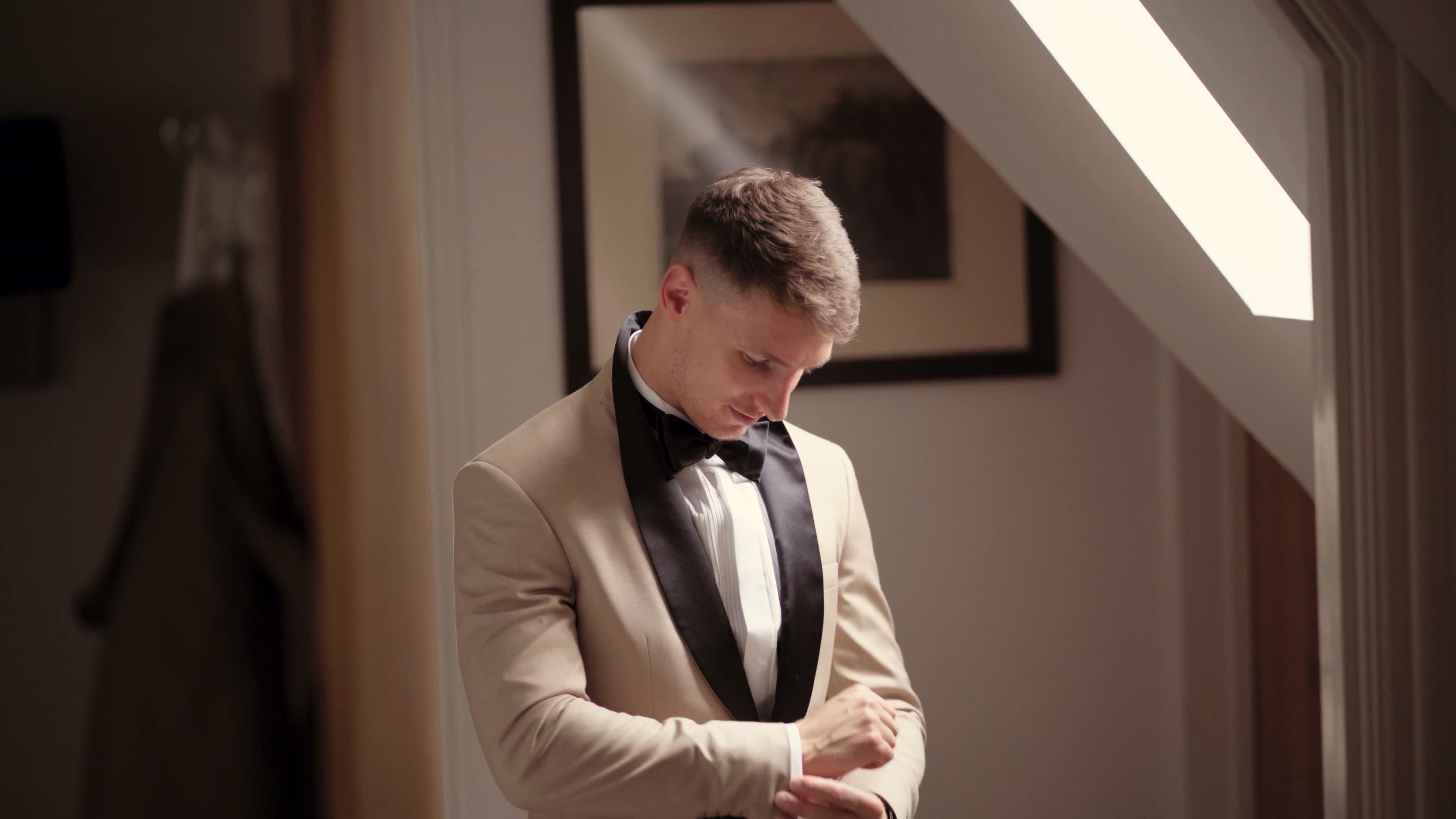 Neave and Ali walking hand-in-hand through the reception space