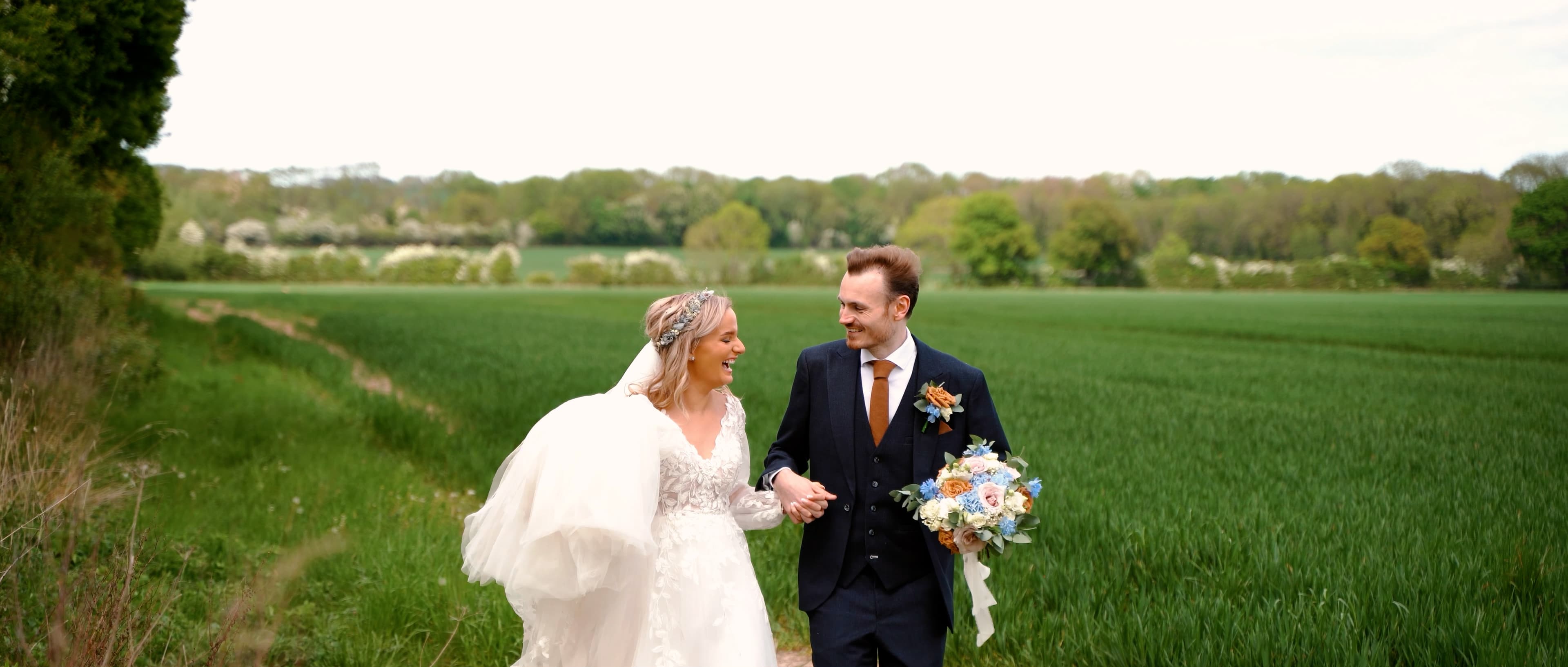 Louise and Samuel celebrating with confetti falling around them