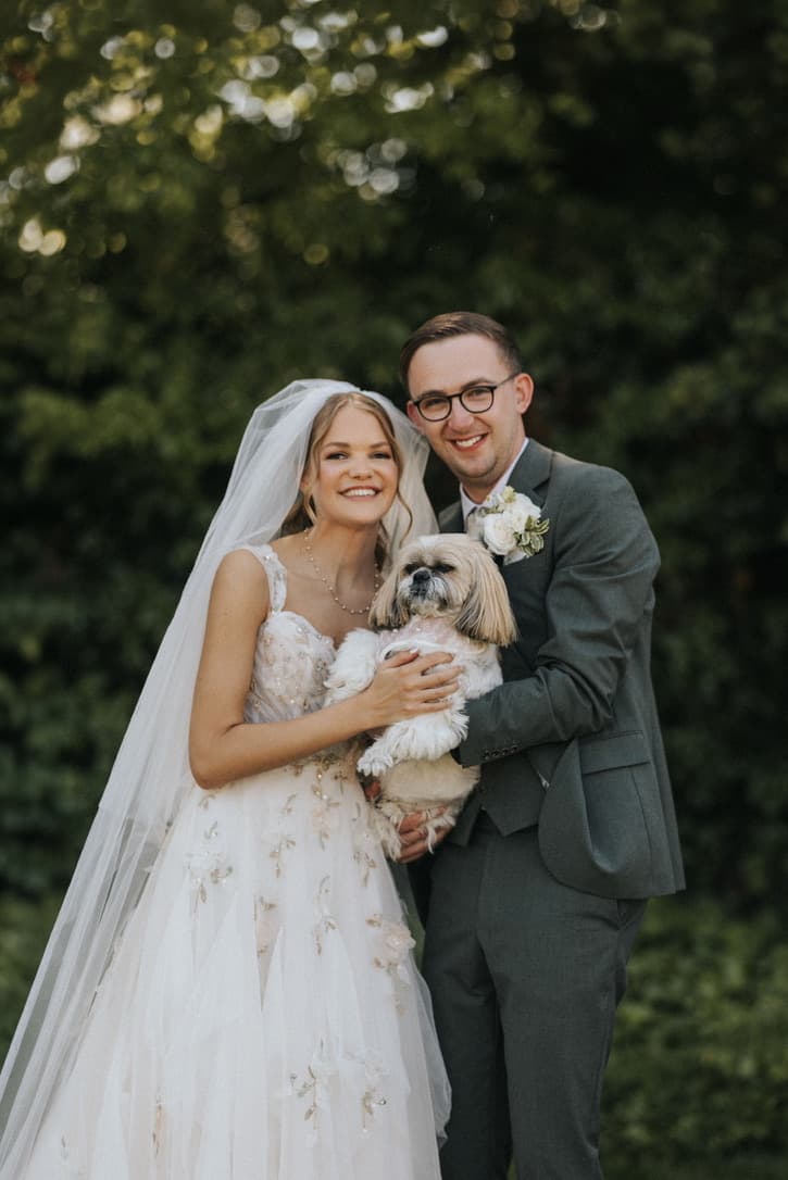 Jacob and Heidi with their dog Willow on their wedding day at Healing Manor